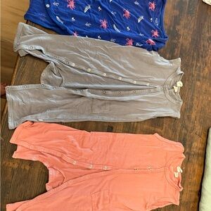 Set of Three Kyte Baby in clothes, Navy, Gray, and Coral